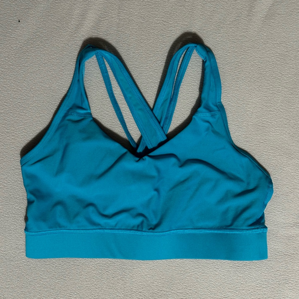 AVIA sports bra. Blue with mesh straps and spaghetti straps on the back.